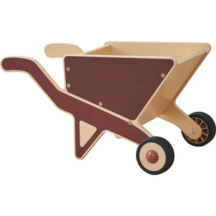 A wooden toy wheelbarrow with a natural light wood body, dark brown painted inner panels, and black wheels with brown centers, shown on a plain white background.