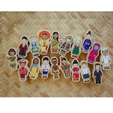 A set of colorful wooden children's toy figures arranged on a woven straw mat background.