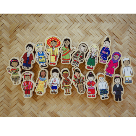 A set of colorful wooden children's toy figures arranged on a woven straw mat background.